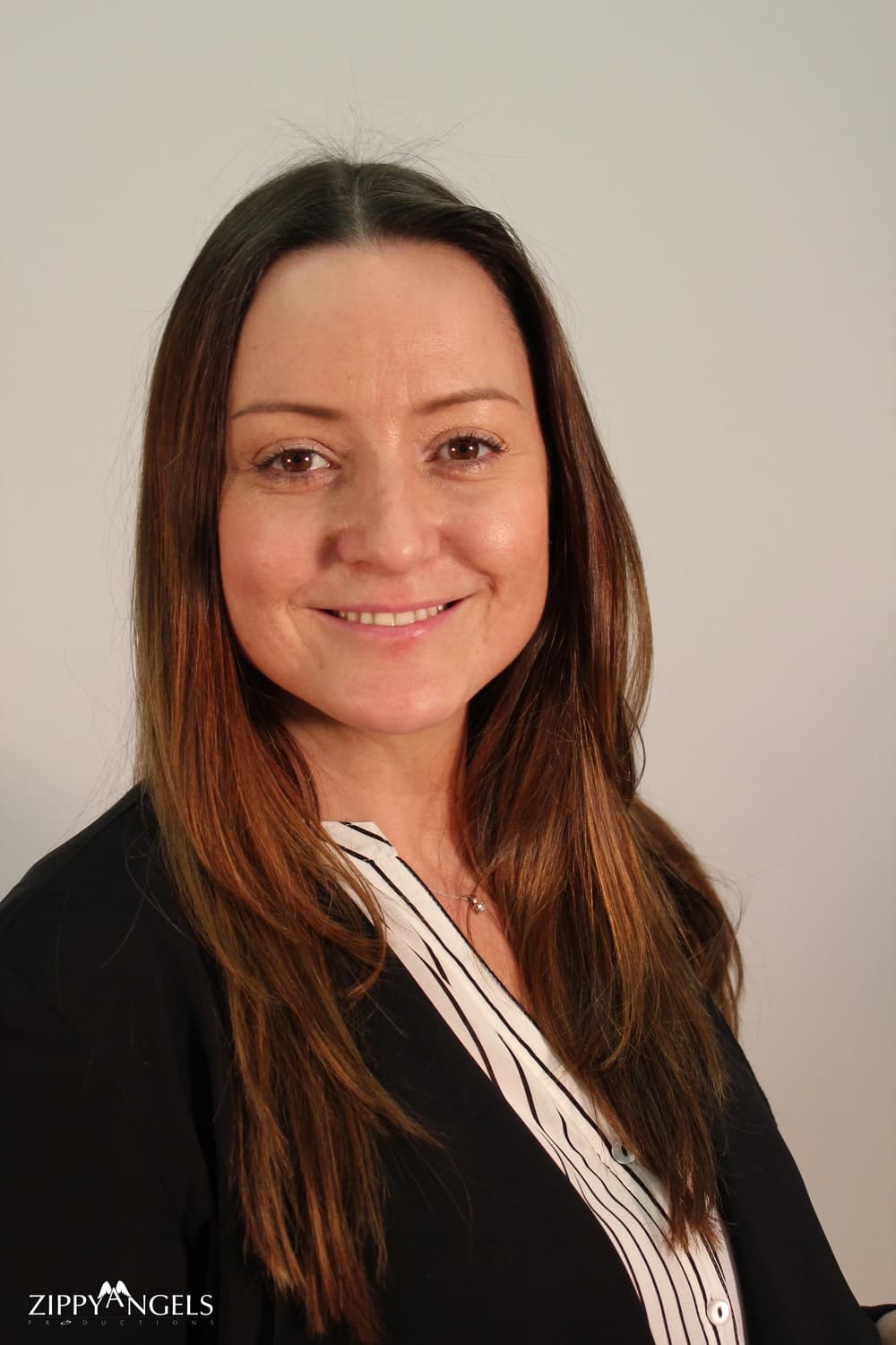 Corporate headshot of smiling woman