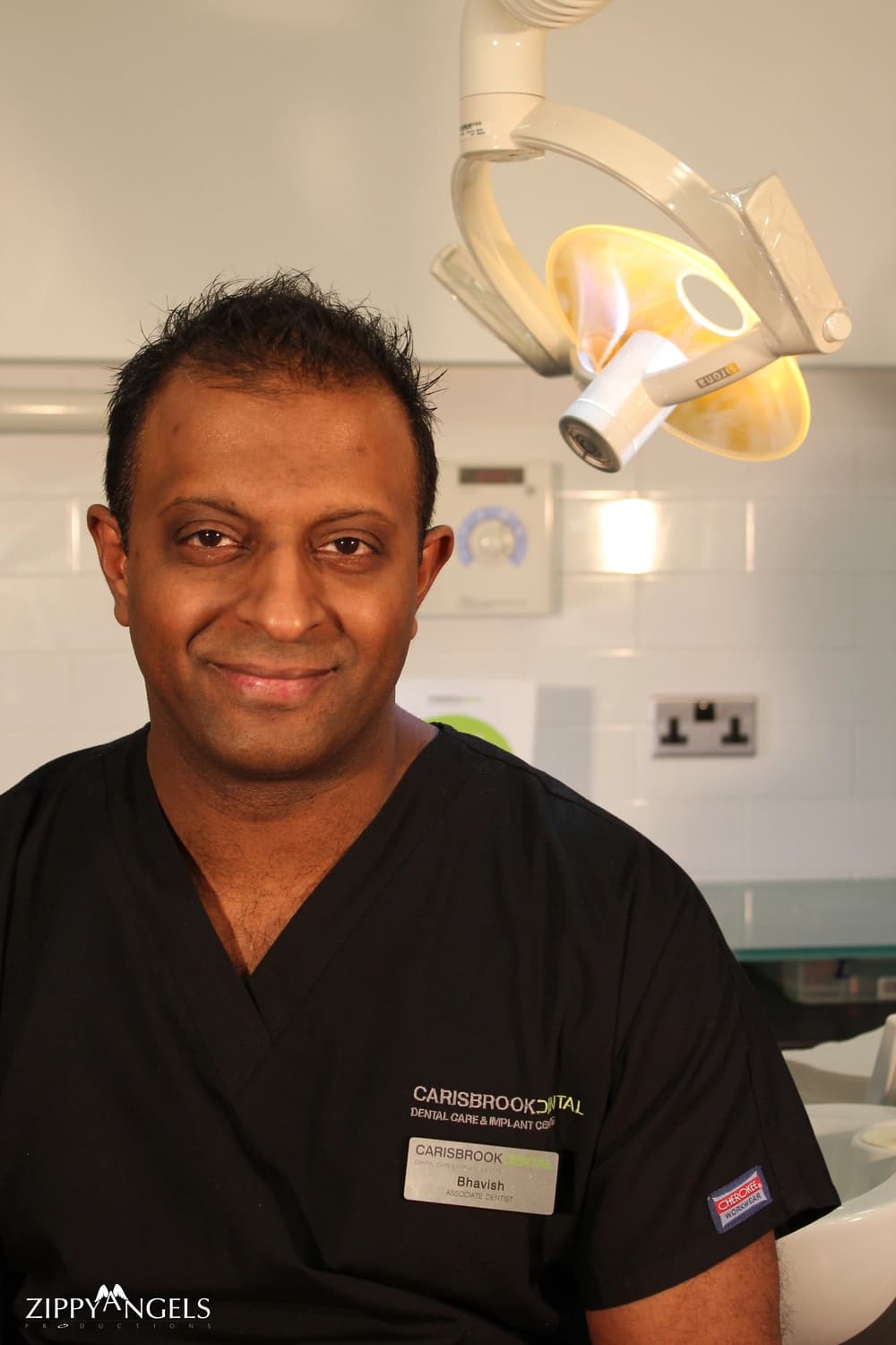Corporate headshot of smiling man