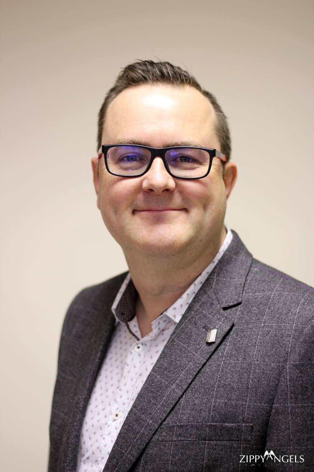 Corporate headshot of smiling man