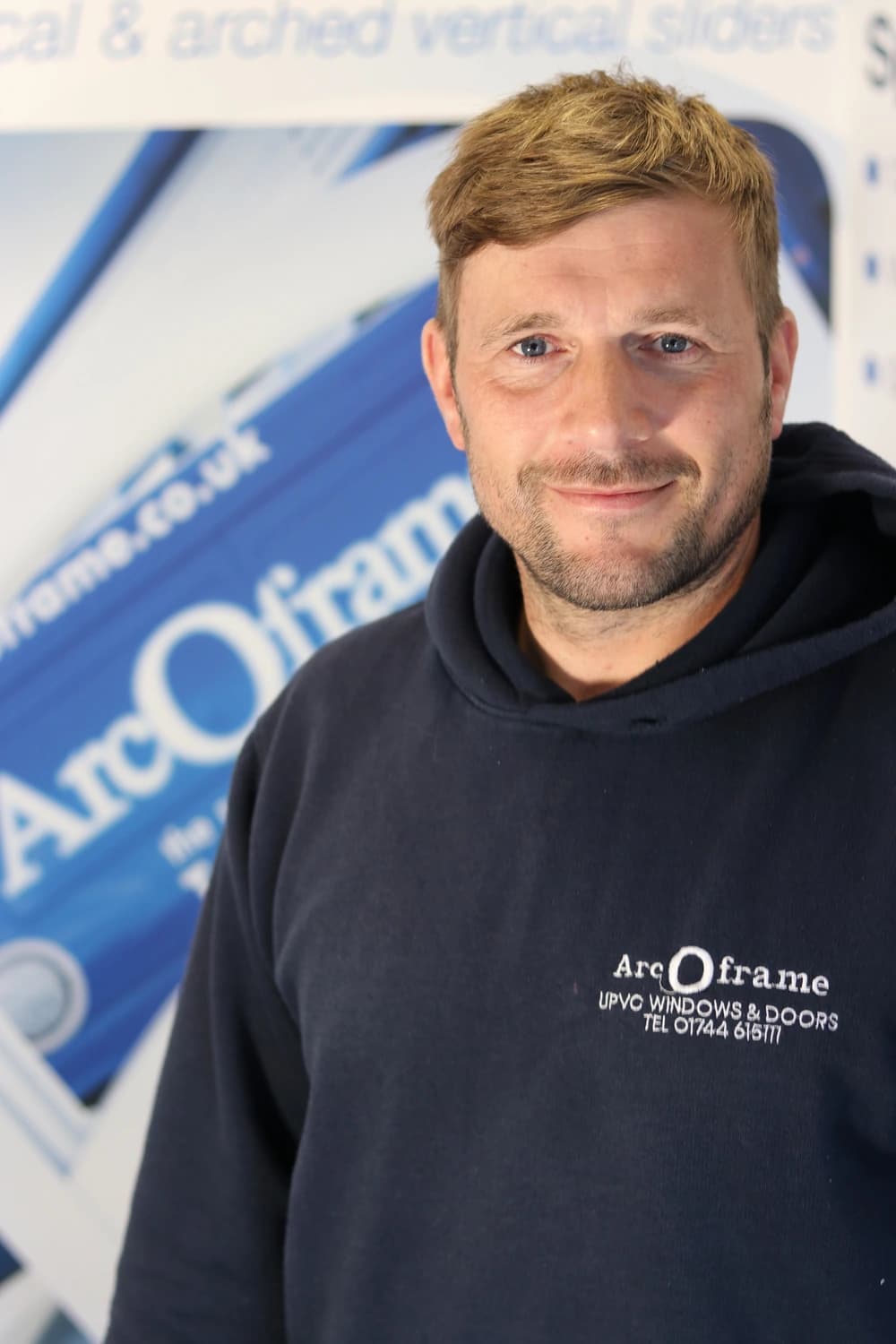 Corporate headshot of smiling man
